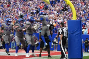 Sep 27, 2026; Orchard Park, New York, USA; Buffalo Bills running back James Cook III (4) celebrates after scoring a touchdown during the fourth quarter against the Los Angeles Chargers at Former Highmark Stadium. Mandatory Credit: Gregory Fisher-Imagn Images