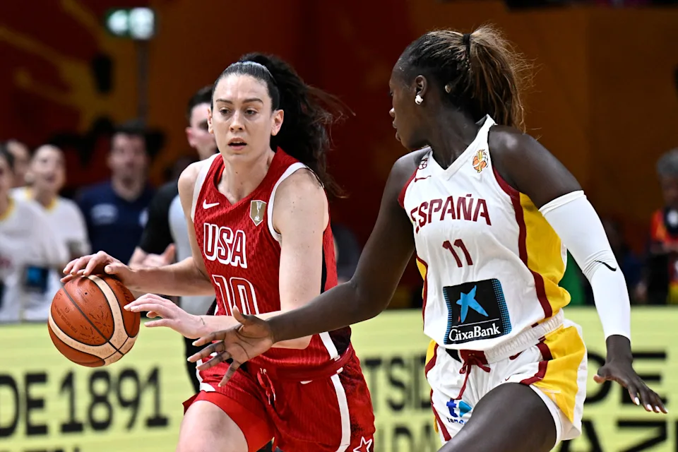 USA forward Breanna Stewart, left, tries to dribble past Spain center Awa Fam during Saturday's FIBA women's World Cup semifinal.