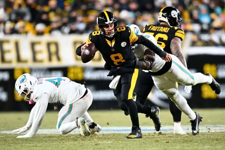 PITTSBURGH, PENNSYLVANIA - DECEMBER 15: Aaron Rodgers #8 of the Pittsburgh Steelers is sacked by Jordyn Brooks #20 of the Miami Dolphins in the first quarter of the game at Acrisure Stadium on December 15, 2025 in Pittsburgh, Pennsylvania. (Photo by Joe Sargent/Getty Images)
