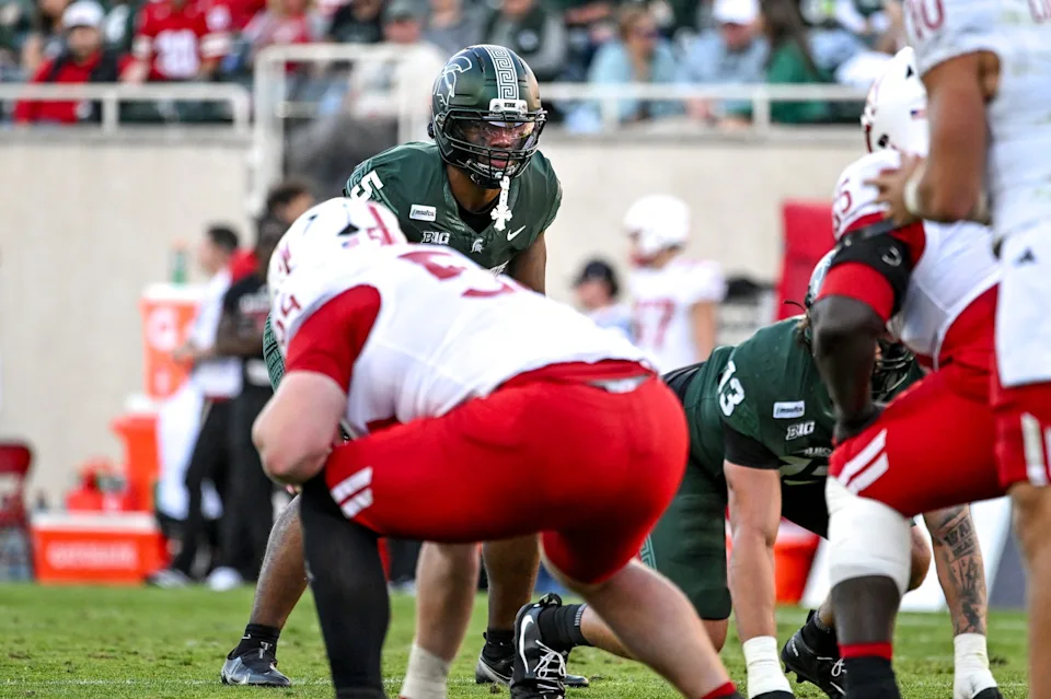 Michigan State's Jordan Hall, center, prepares for the play against Nebraska during the second quarter on Saturday, Sept. 26, 2026, in East Lansing.