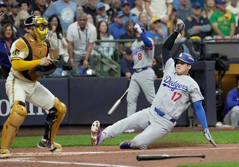 Los Angeles Dodgers two-way player Shohei Ohtani (17) scores a run during the second inning of their National League Championship Series game against the Milwaukee Brewers at American Family Field on Oct 11, 2026.
