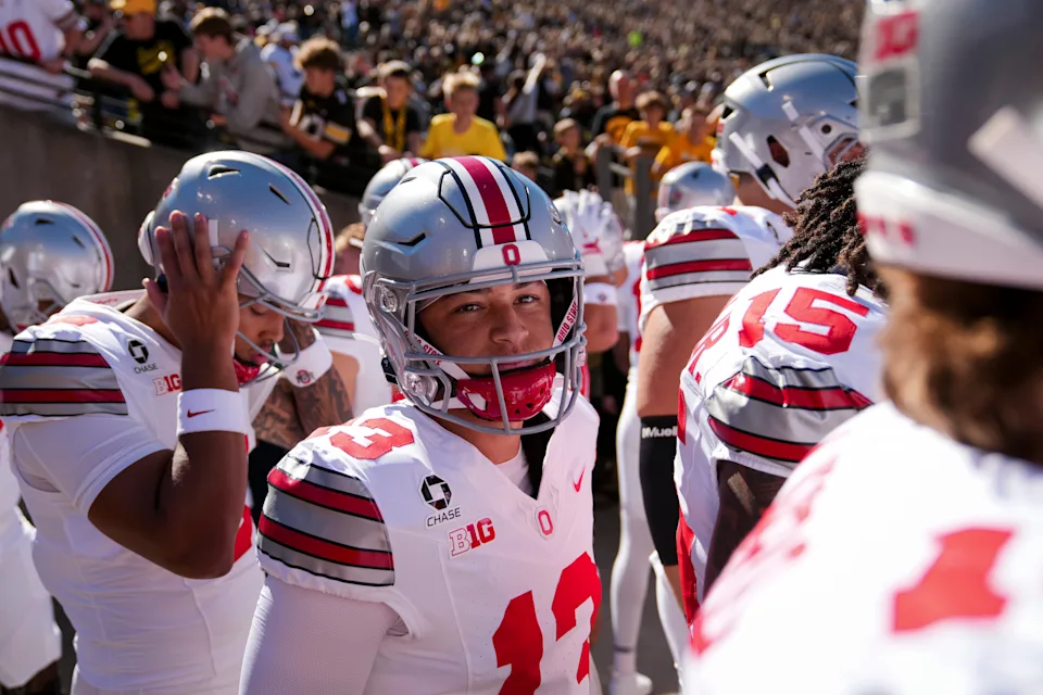 Quarterback Luke Fahey (13) and the Ohio State Buckeyes take the field for warm ups prior to the NCAA football game against the Iowa Hawkeyes at Kinnick Stadium in Iowa City on Oct. 3, 2026.